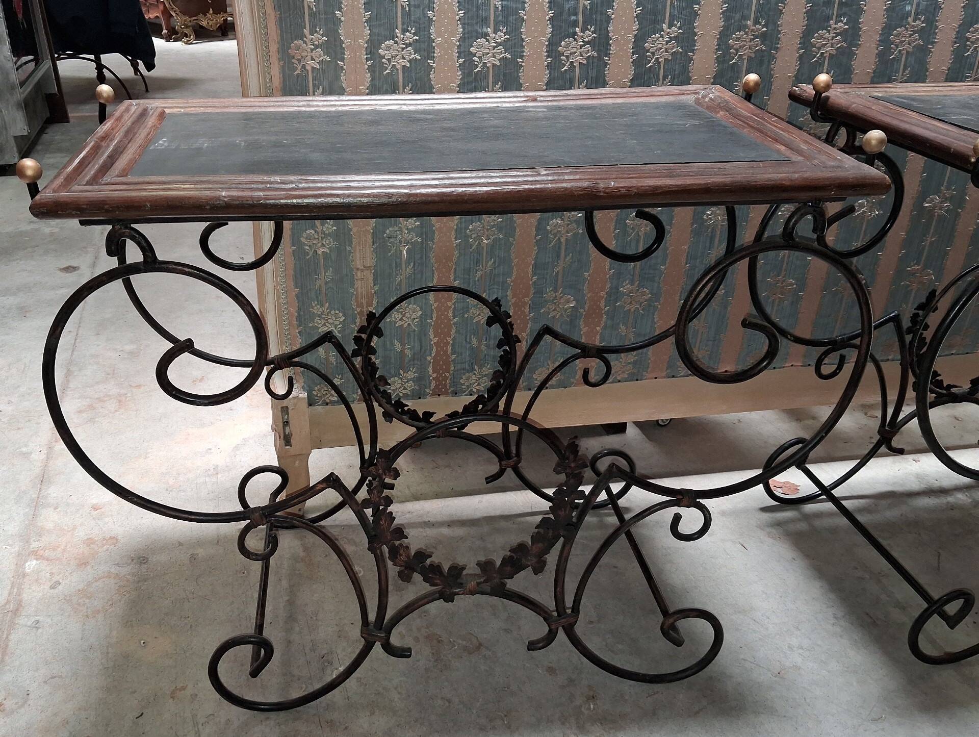 Pair of wrought iron and blackened wood consoles from the mid-20th century.