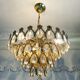 Vintage chandelier in gilded brass with crystal pendants.