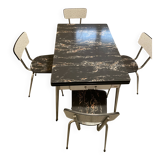 Table and 4 chairs in Formica.
