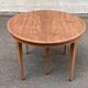Renovated round extendable dining table made of solid mahogany from the 19th century.