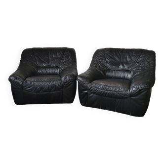 Pair of black leather armchairs from the 80s