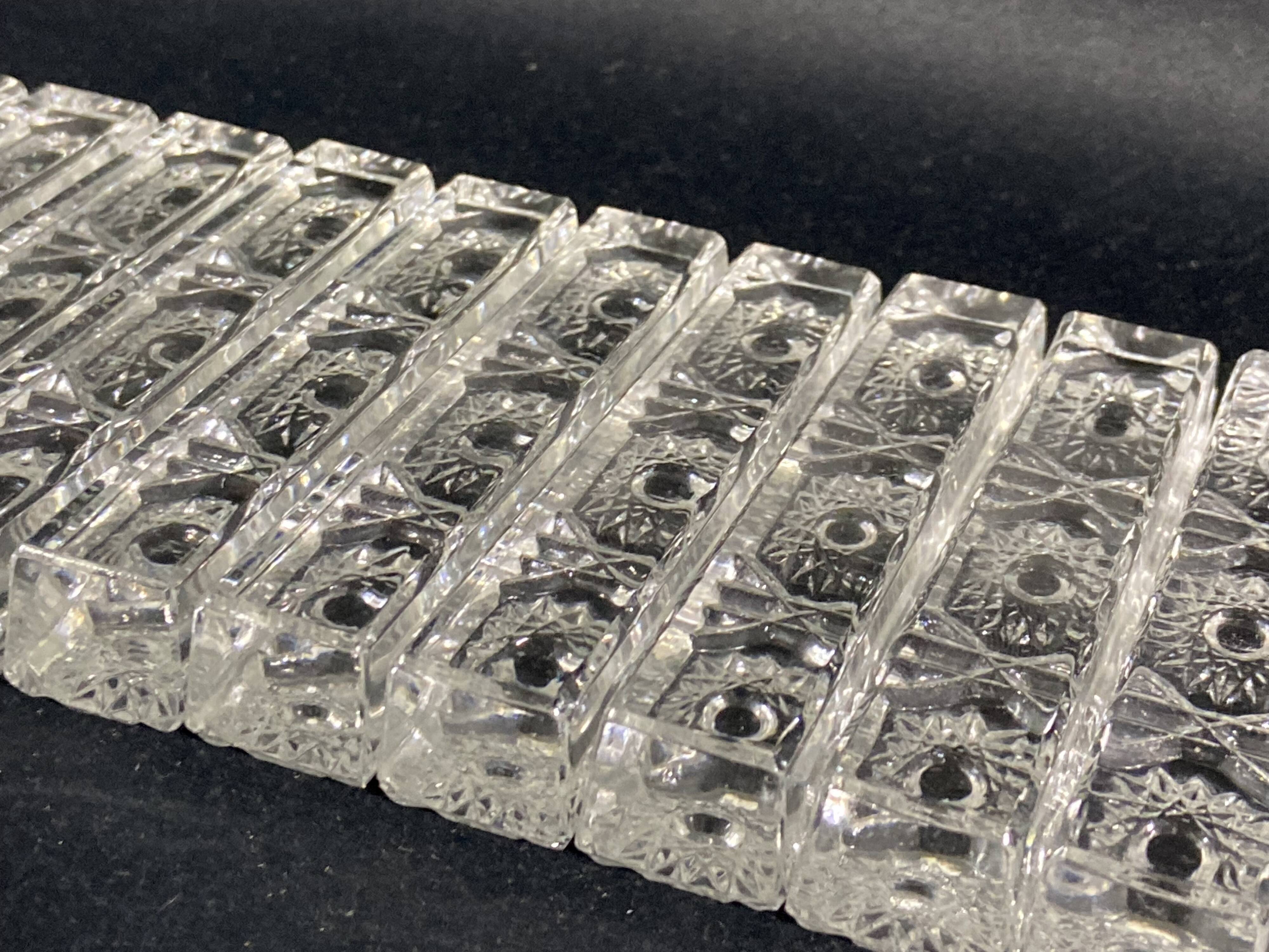 Set of 12 molded glass or crystal knife rests with diamond point decor