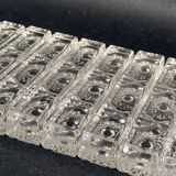 Set of 12 molded glass or crystal knife rests with diamond point decor
