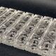 Set of 12 molded glass or crystal knife rests with diamond point decor