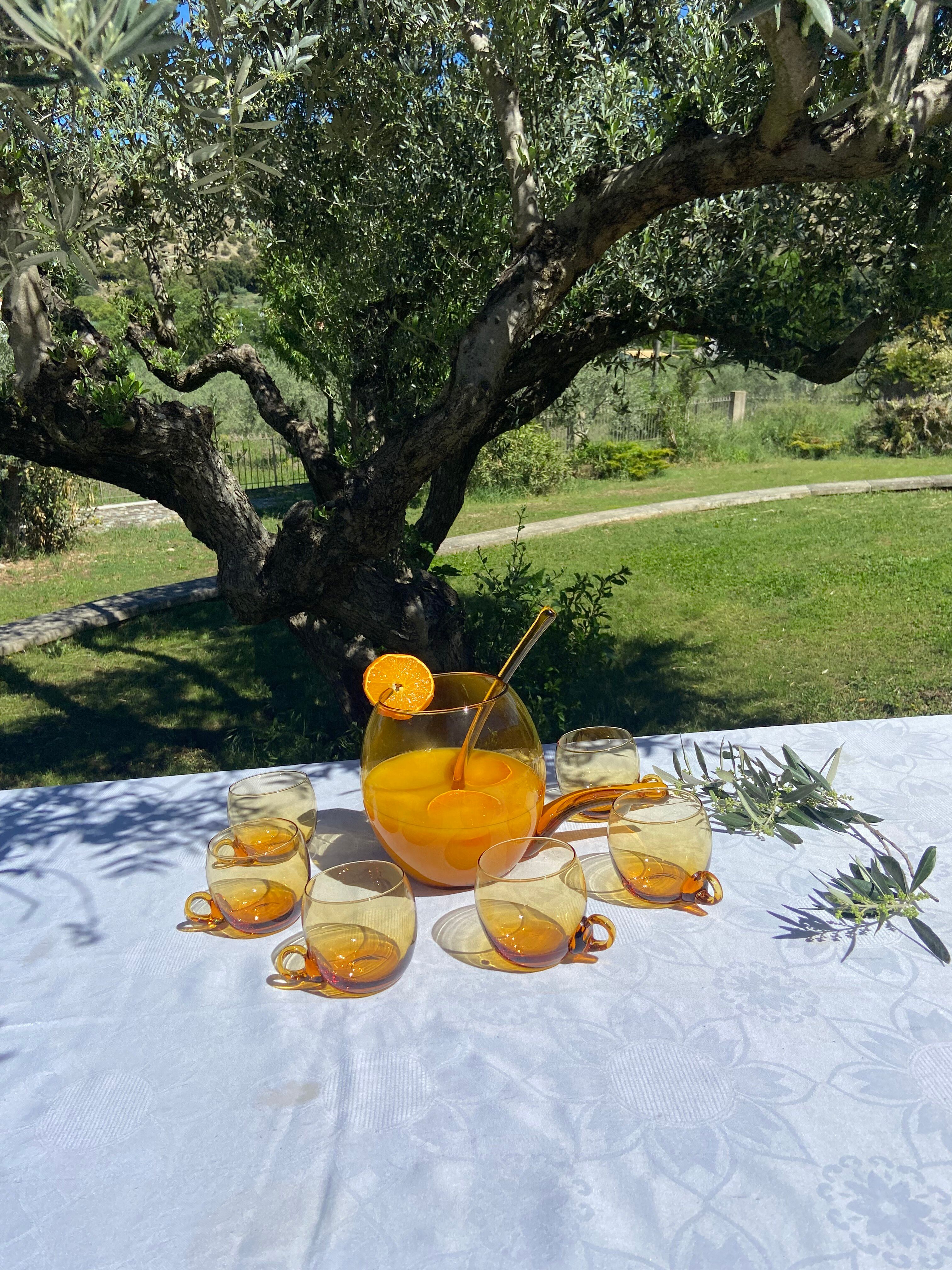 Punch or cocktail service in amber glass