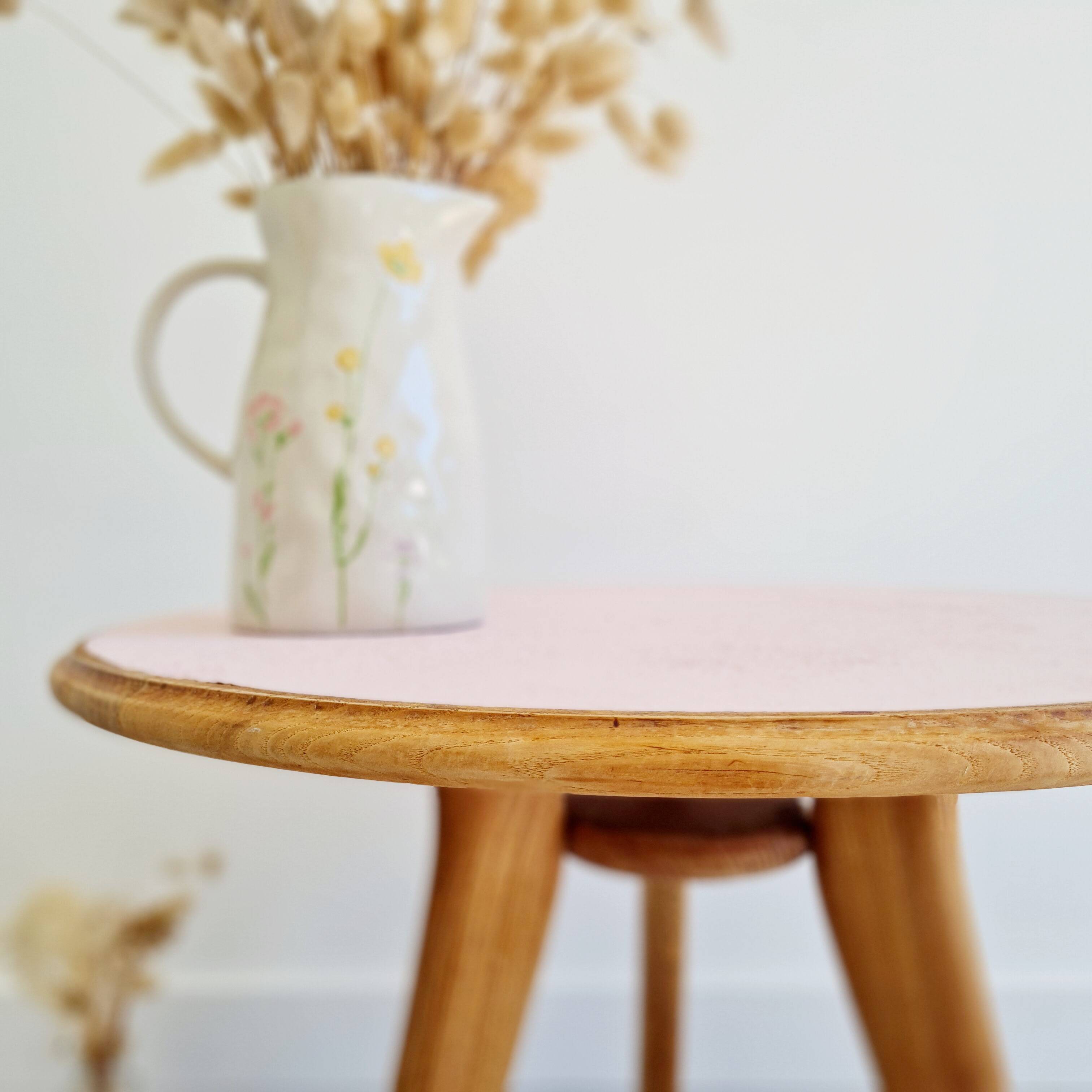 Pink round top tripod coffee table