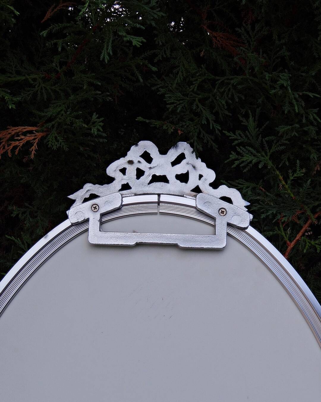 Oval mirror 66x37 Louis XVI style knot in vintage silver metal from the 70s
