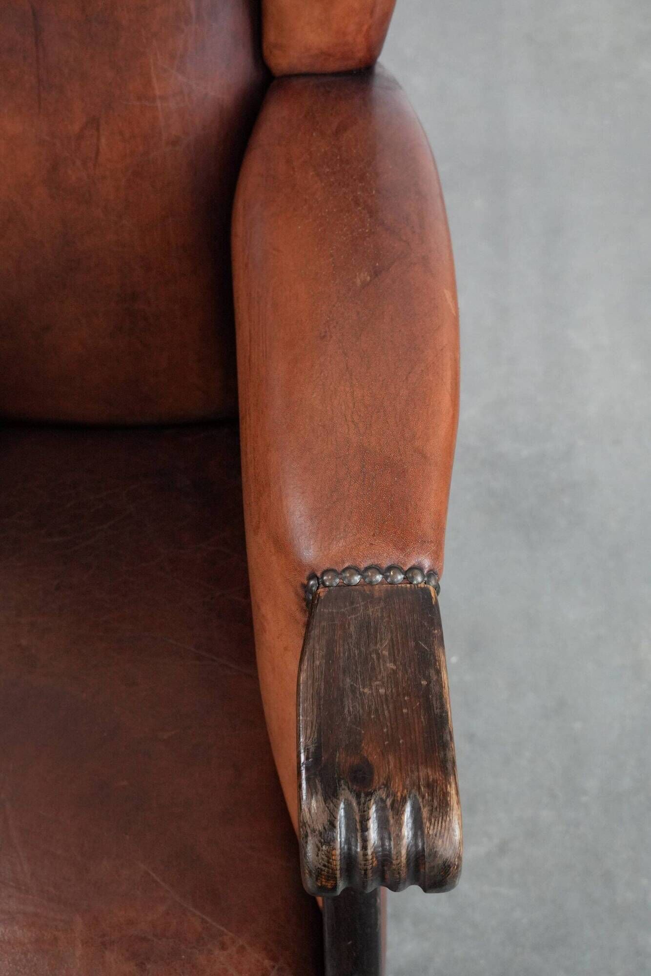 Classic vintage wingback chair in sheepskin and wood