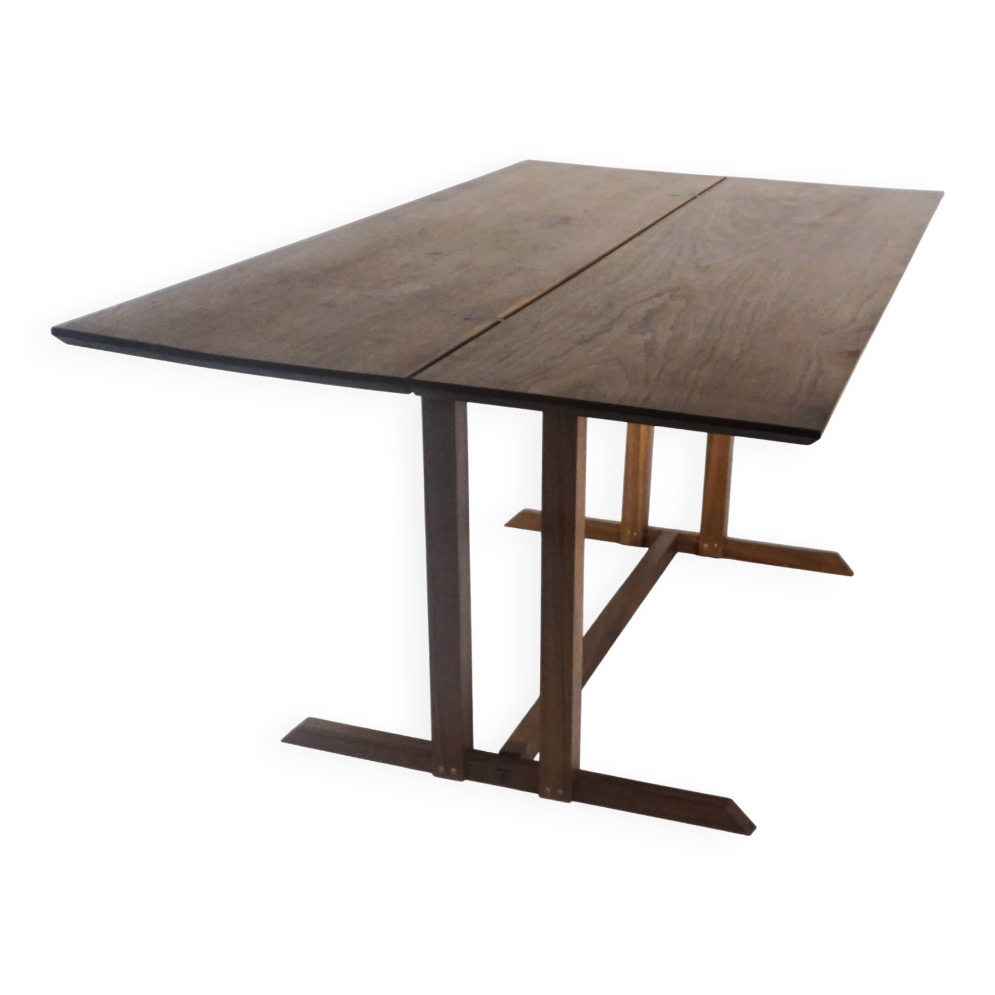 Exceptional dining table in solid walnut.