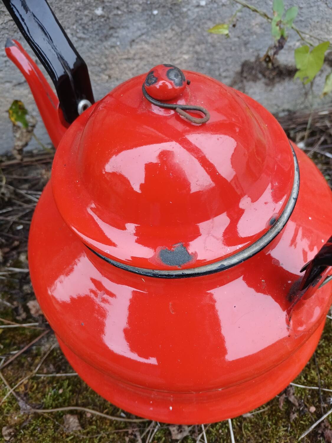Antique teapot in red enamelled sheet metal