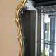 Golden wall mirror with gold leaf Deknudt - beveled ice - Louis XV style
