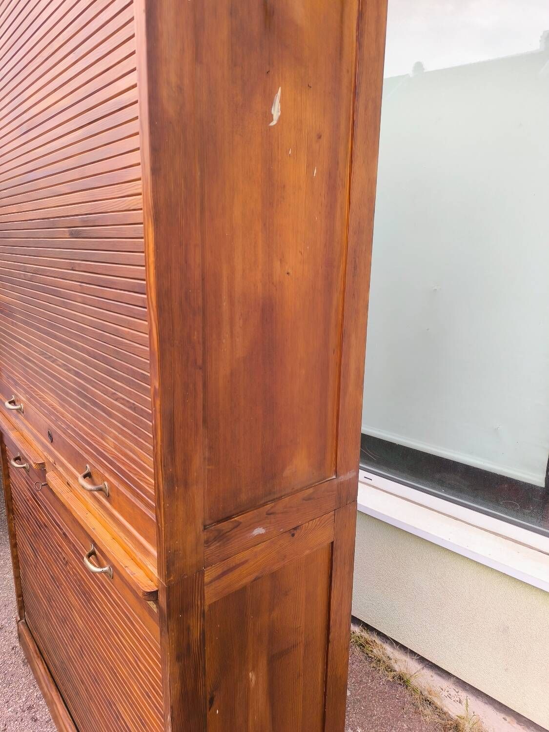 Vintage 1940s secretary desk with wooden curtains, storage, and shutters.