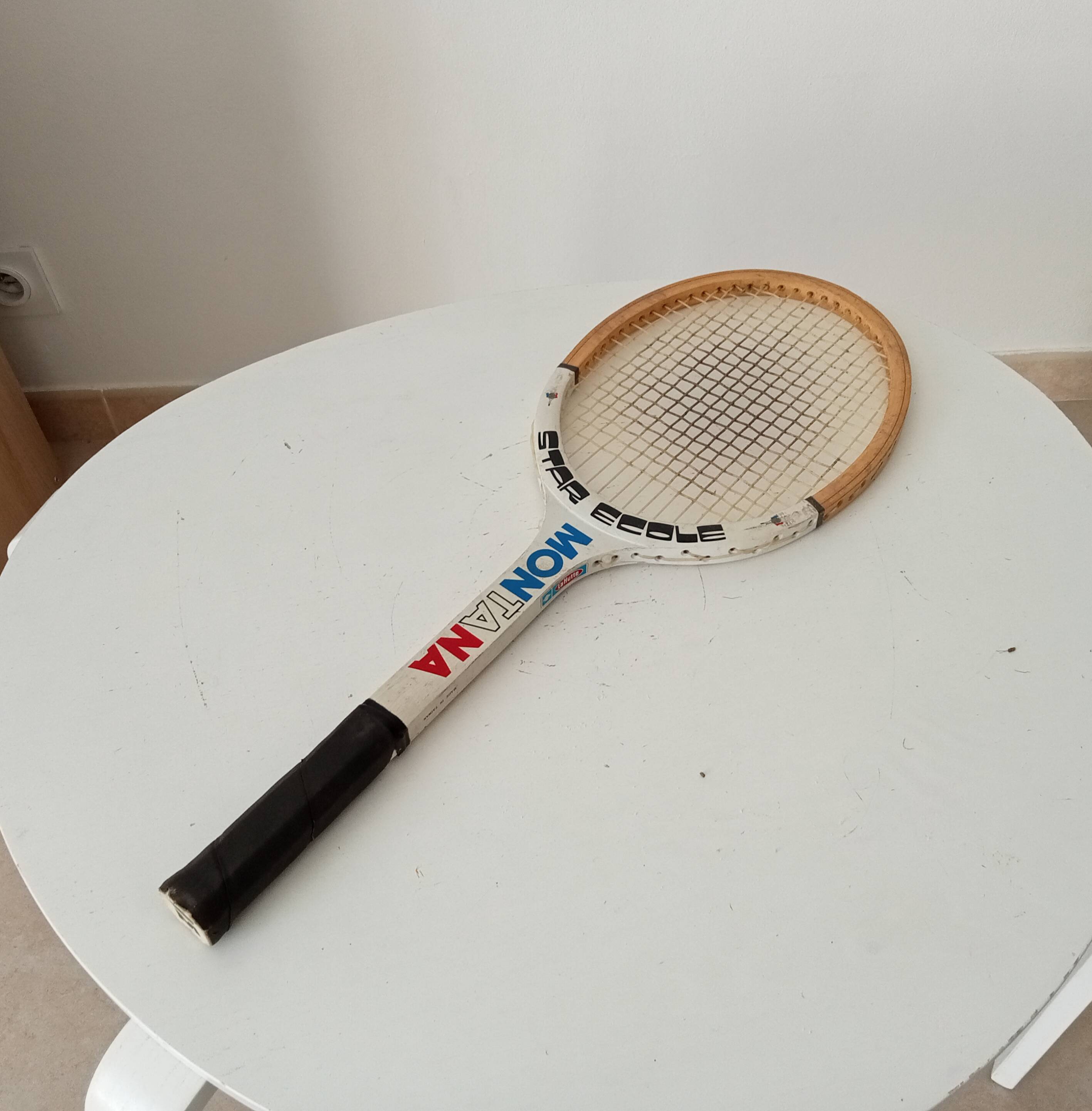 Vintage wooden tennis racket Montana