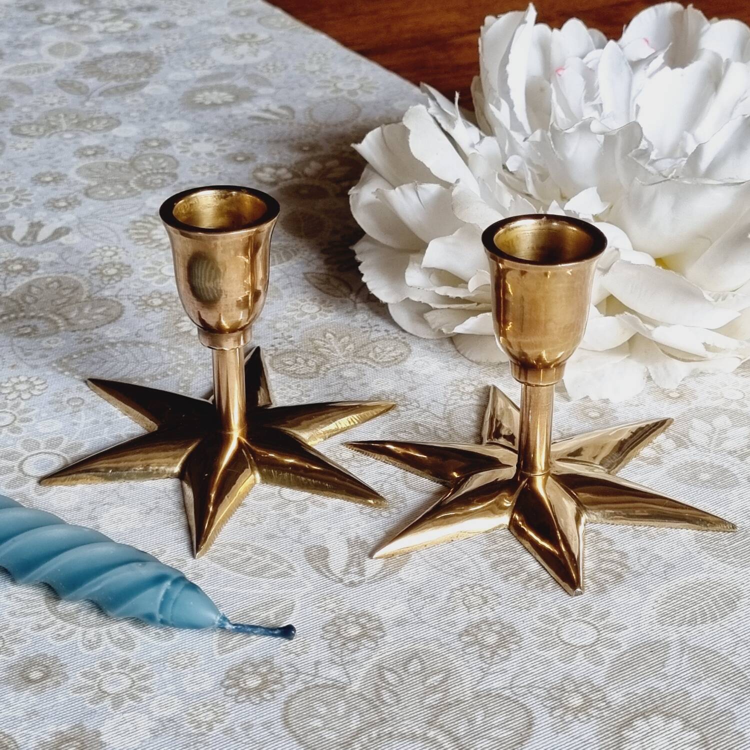 Duo of brass star candlesticks