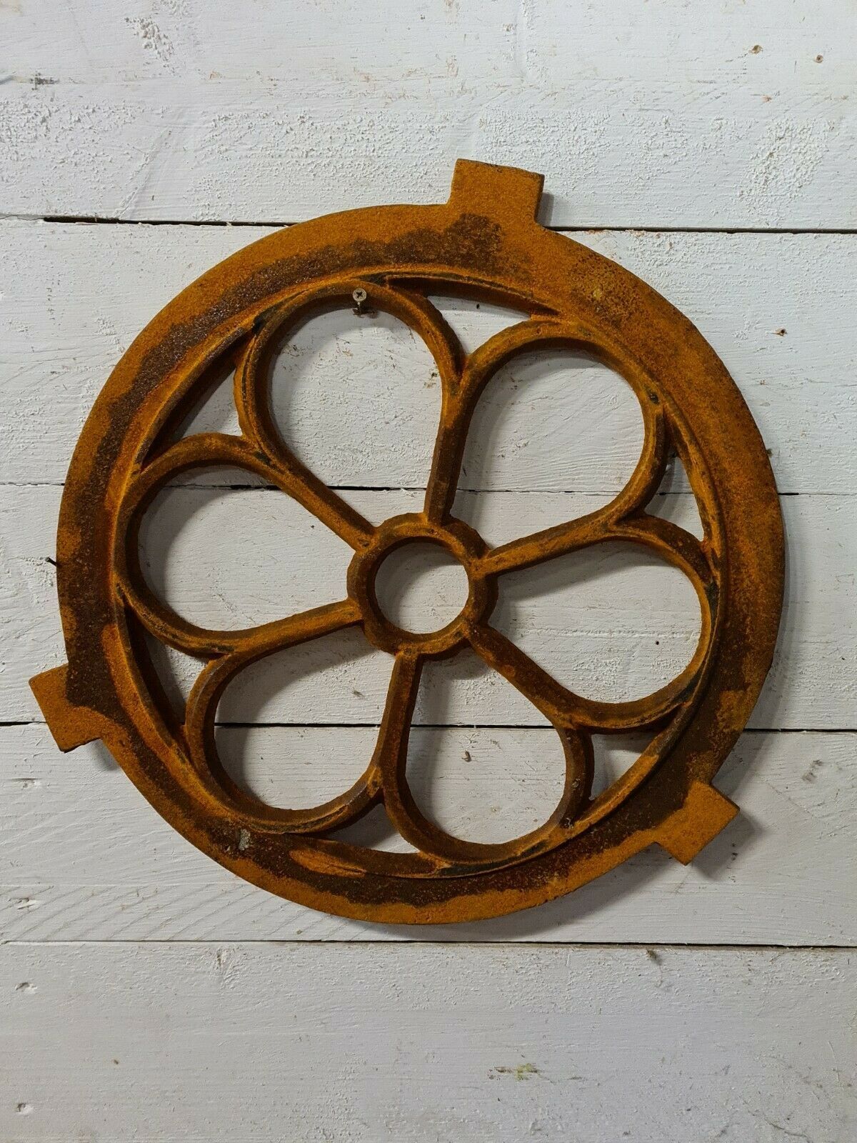 Cast iron ox's eye window in the shape of a flower