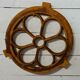 Cast iron ox's eye window in the shape of a flower