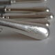 12 couteaux de table ancien metal argente monogramme
