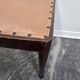 Vintage wooden ottoman from the 1940s with a silk top and studded trim.