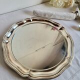 Round silver-plated serving dish with a glass base.