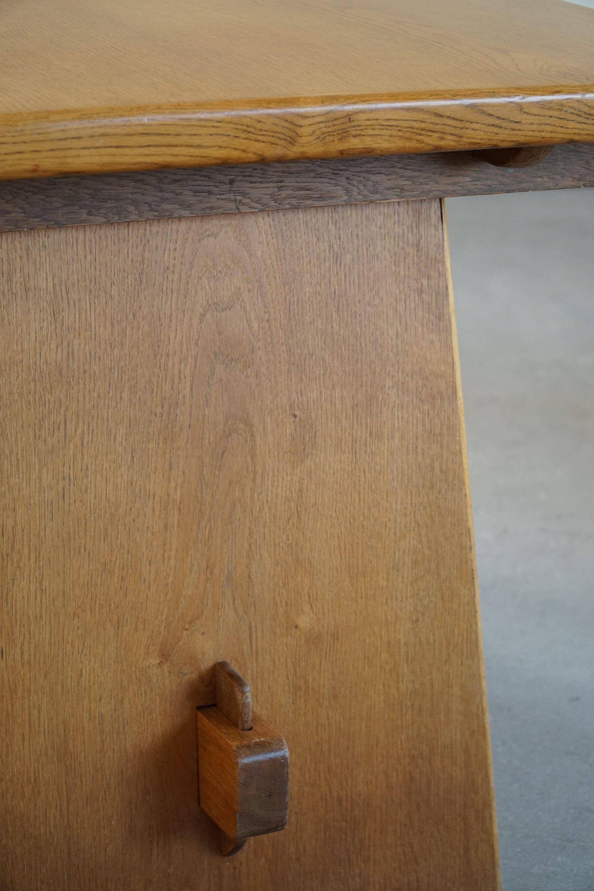Mid-century brutalist dining table, made of oak, Danish craftsmanship, 1950s.