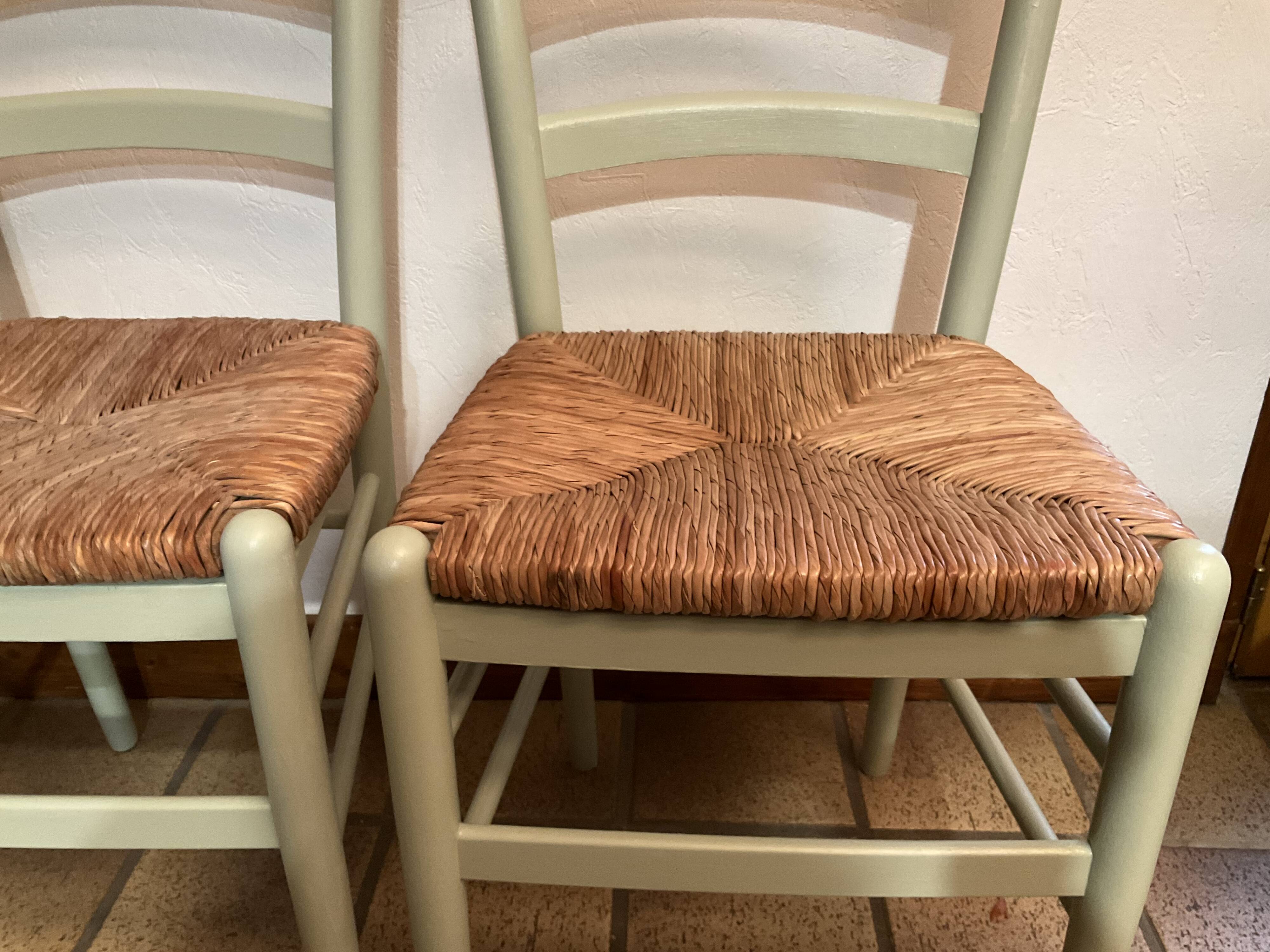Pair of green straw sitting chairs