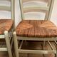 Pair of green straw sitting chairs