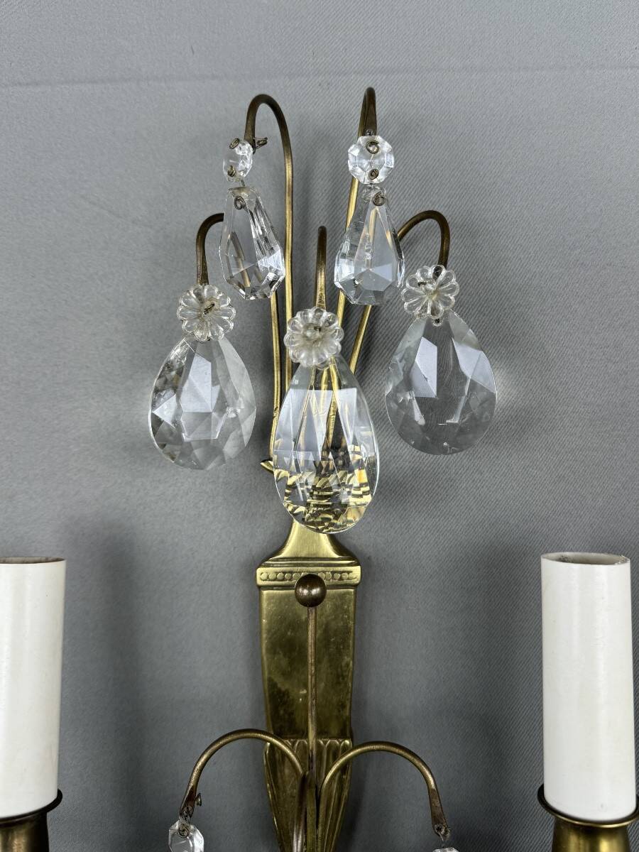 Pair of brass and crystal wall lights, 20th Century