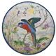 Large earthenware dish decorated with a parrot.