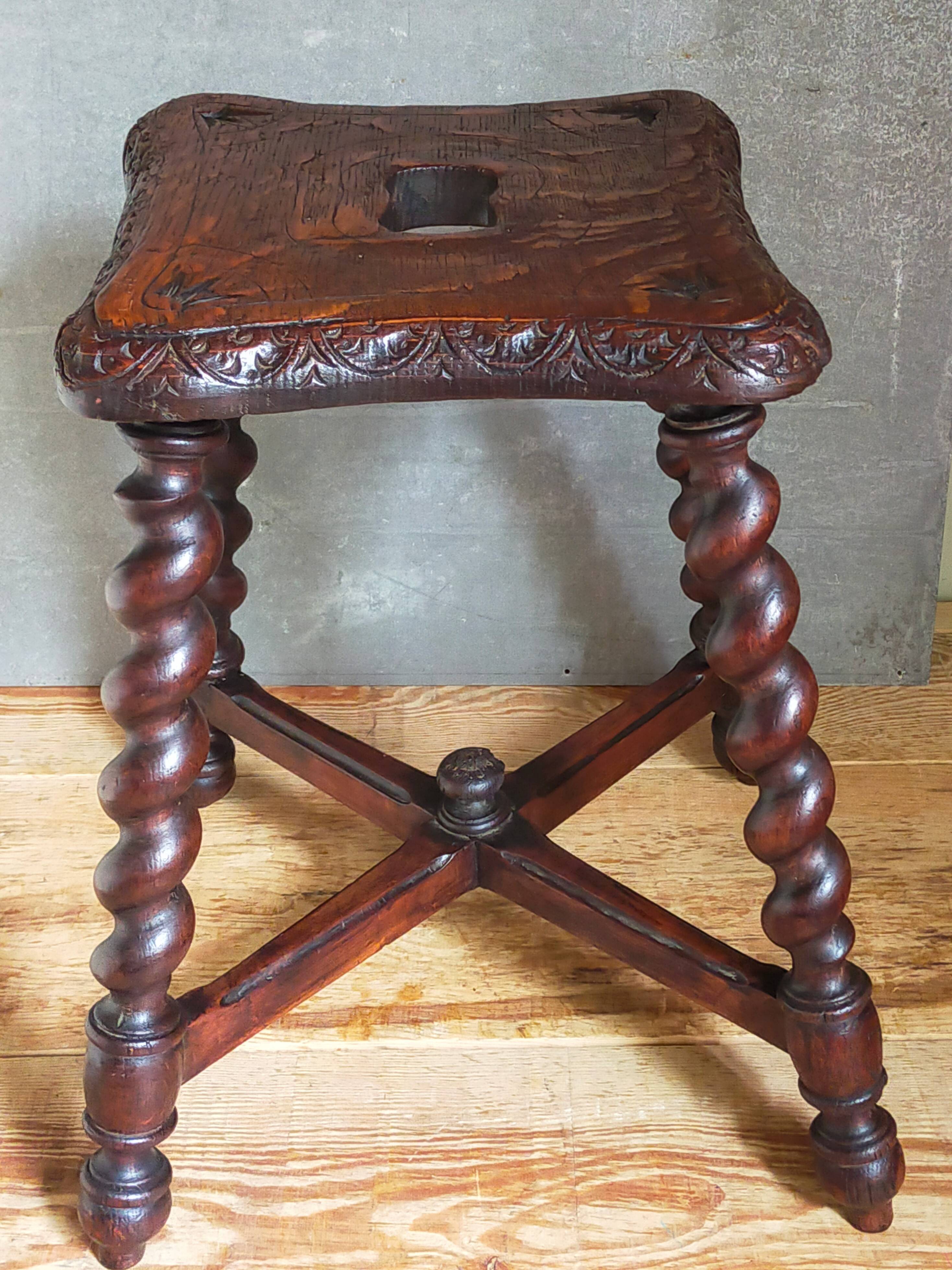 Antique stool in turned and carved solid wood