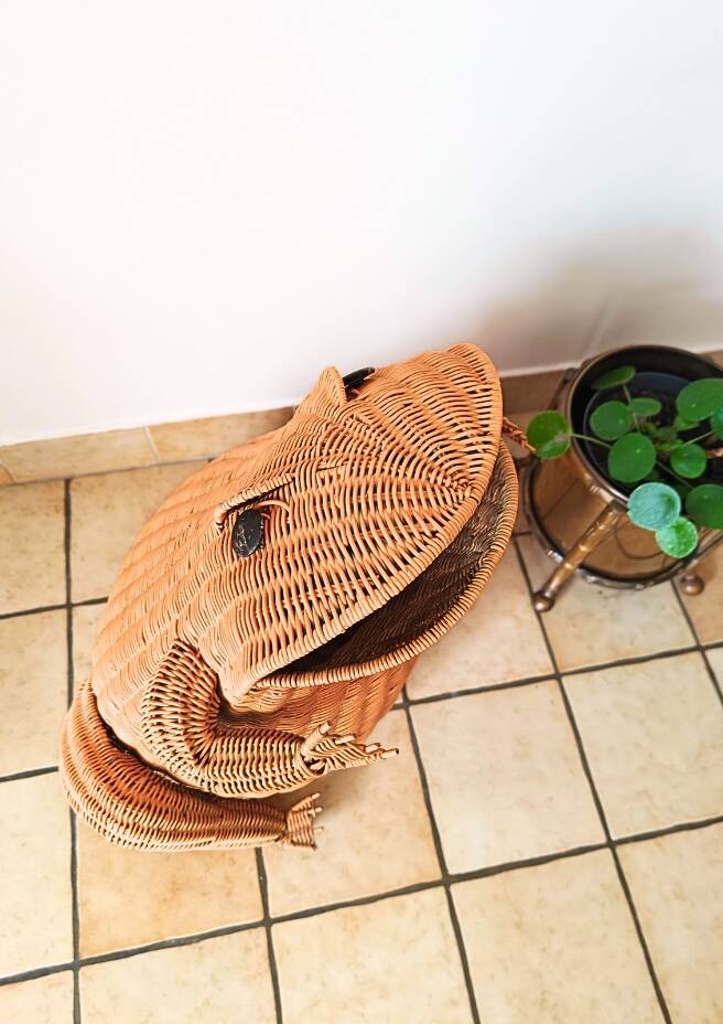 Vintage frog magazine rack in woven wicker design by Olivier Cajan
