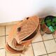 Vintage frog magazine rack in woven wicker design by Olivier Cajan