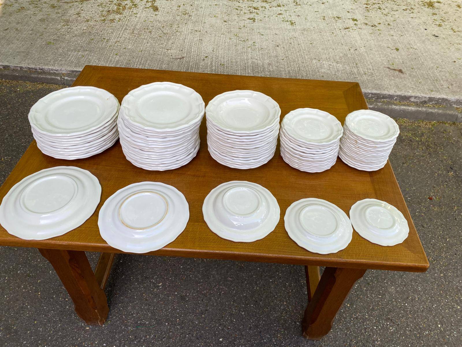 Service of 84 vintage white porcelain plates.