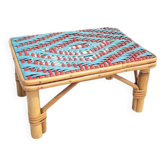 Small side table in red and celadon green rattan.
