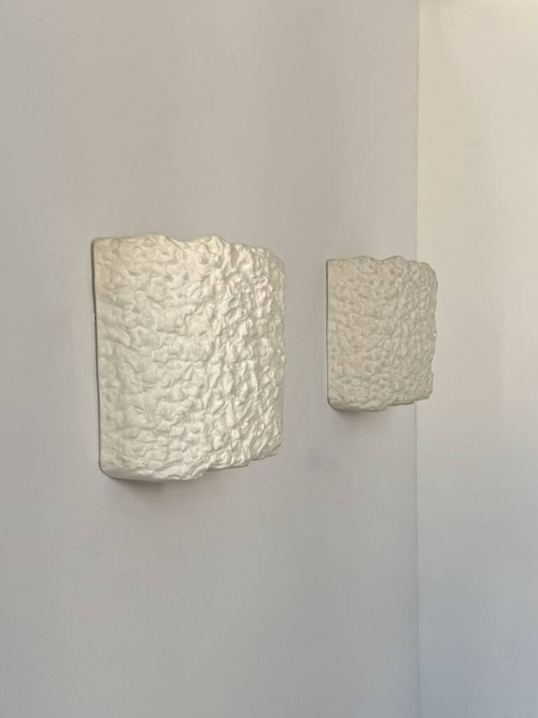 Pair of vintage wall lights in smooth plaster and stone imitation, France, 1970.