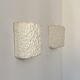 Pair of vintage wall lights in smooth plaster and stone imitation, France, 1970.