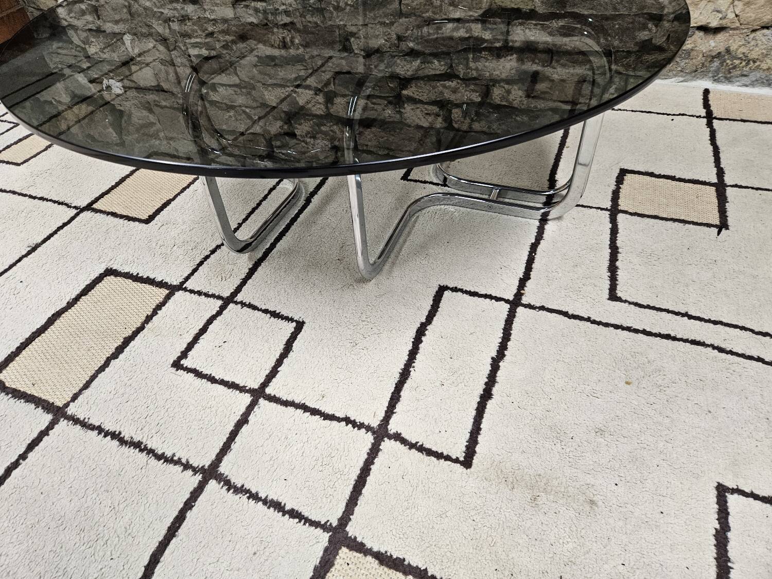 Round chrome coffee table with smoked glass