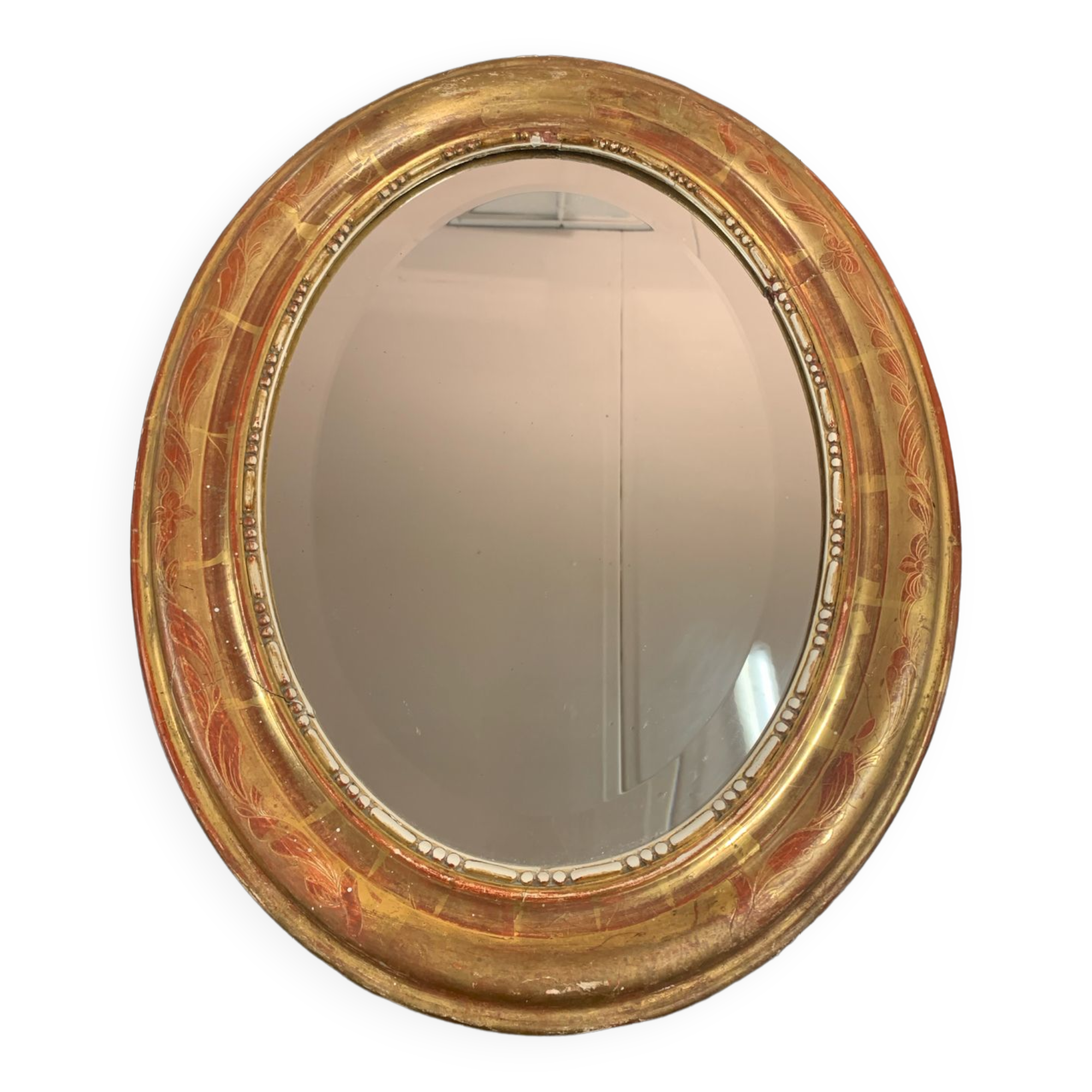 Golden oval mirror