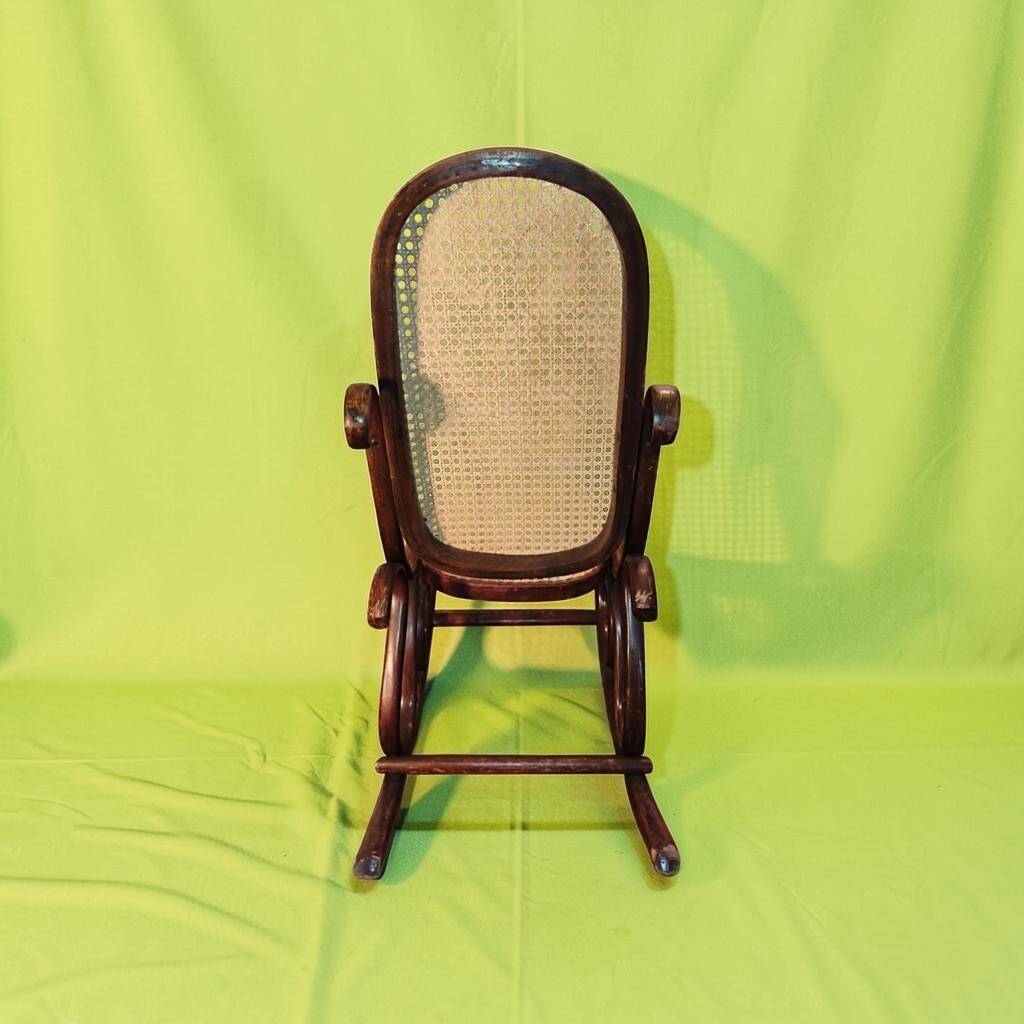 Antique curved wooden rocking chair with caning in Thonet style - Child size