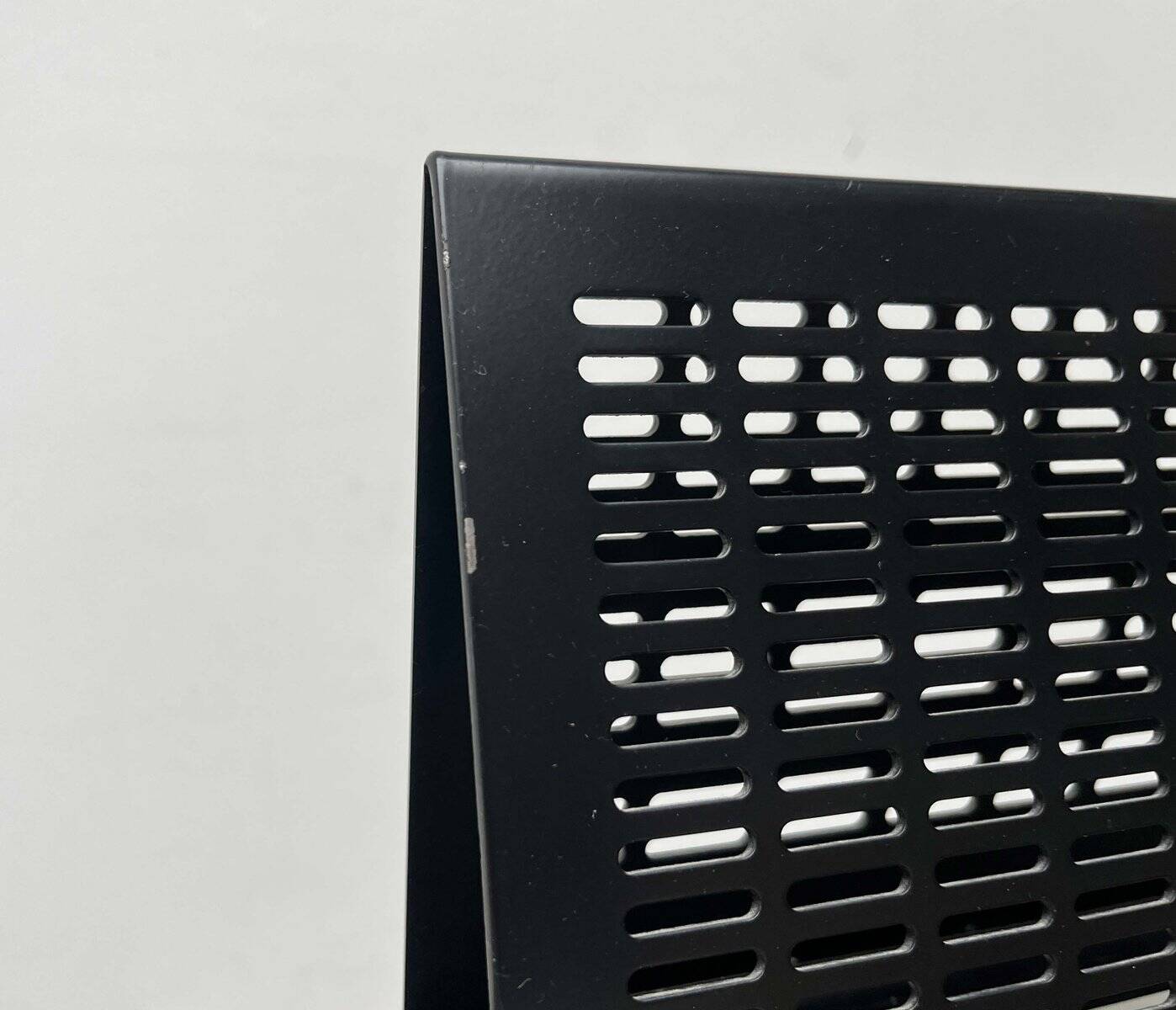 Postmodern black Quinta chair in perforated metal by Mario Botta for Alias, 1980s.