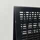 Postmodern black Quinta chair in perforated metal by Mario Botta for Alias, 1980s.