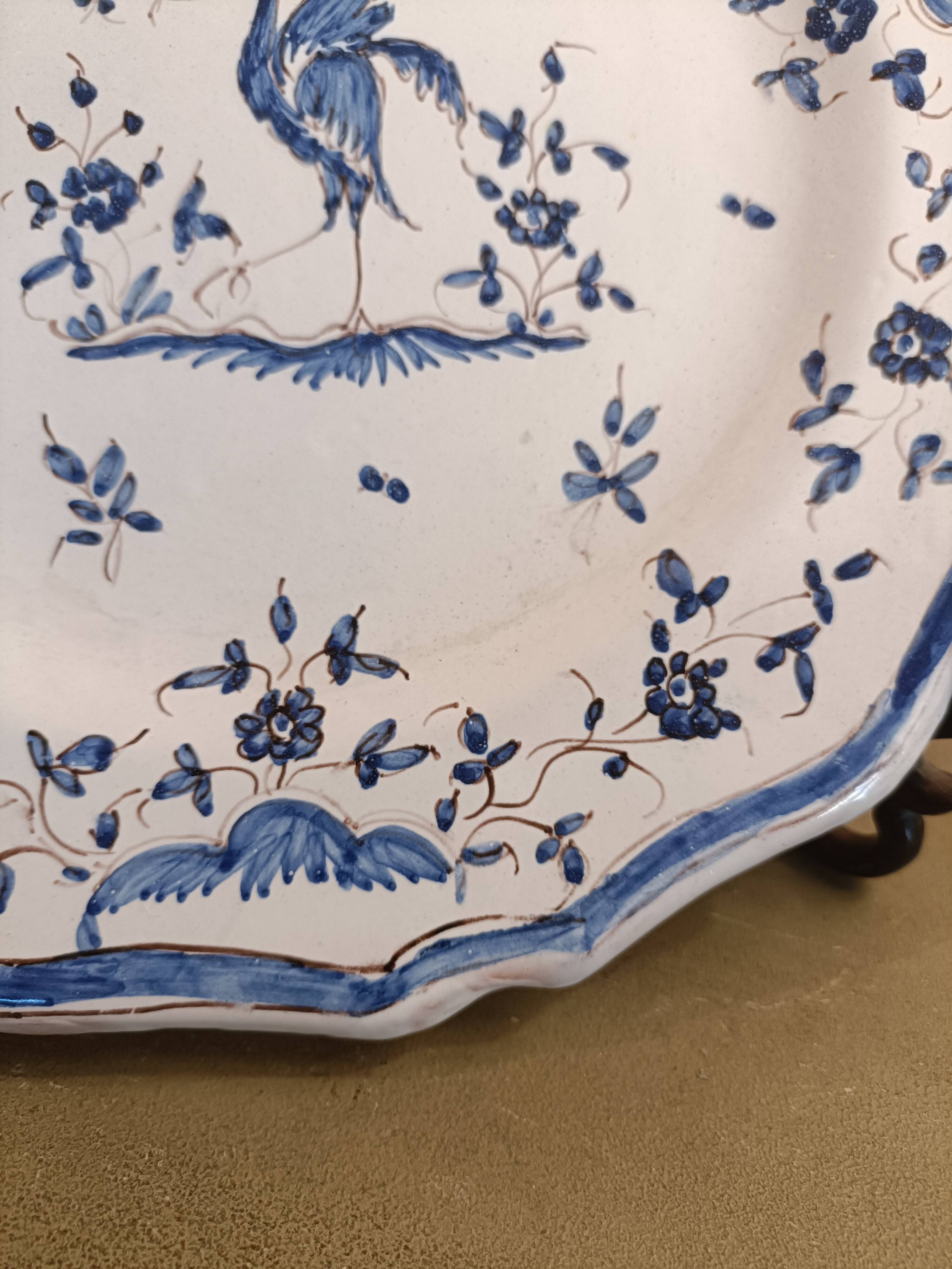 Old Moustiers faience plate blue and white with blue ibis decoration.