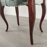 Glass art deco mirror beside table