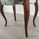 Glass art deco mirror beside table