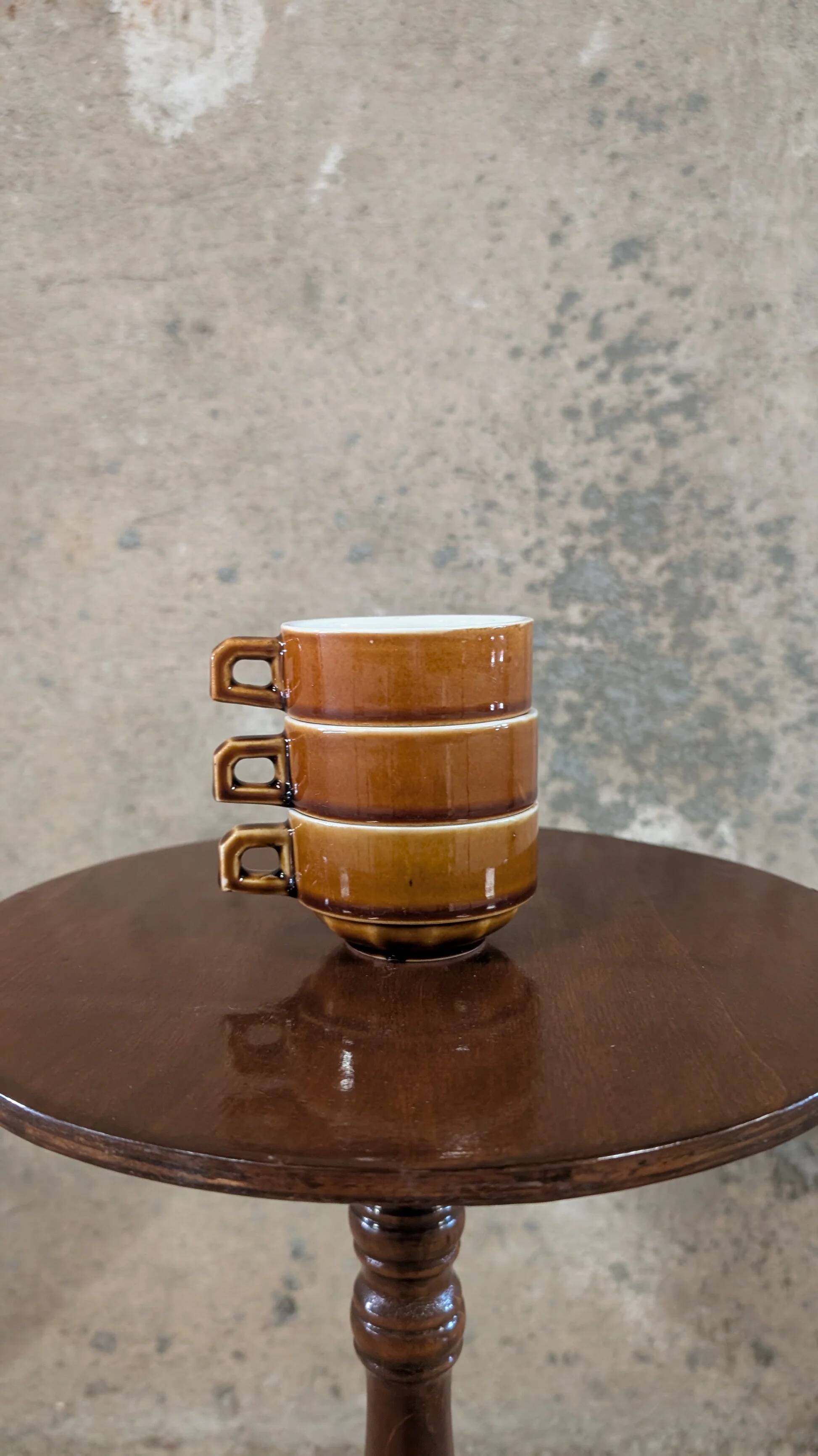 Trio of brown stoneware cups