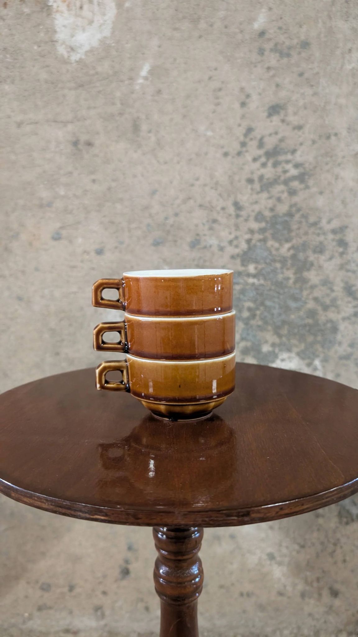 Trio of brown stoneware cups