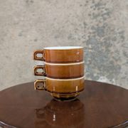 Trio of brown stoneware cups