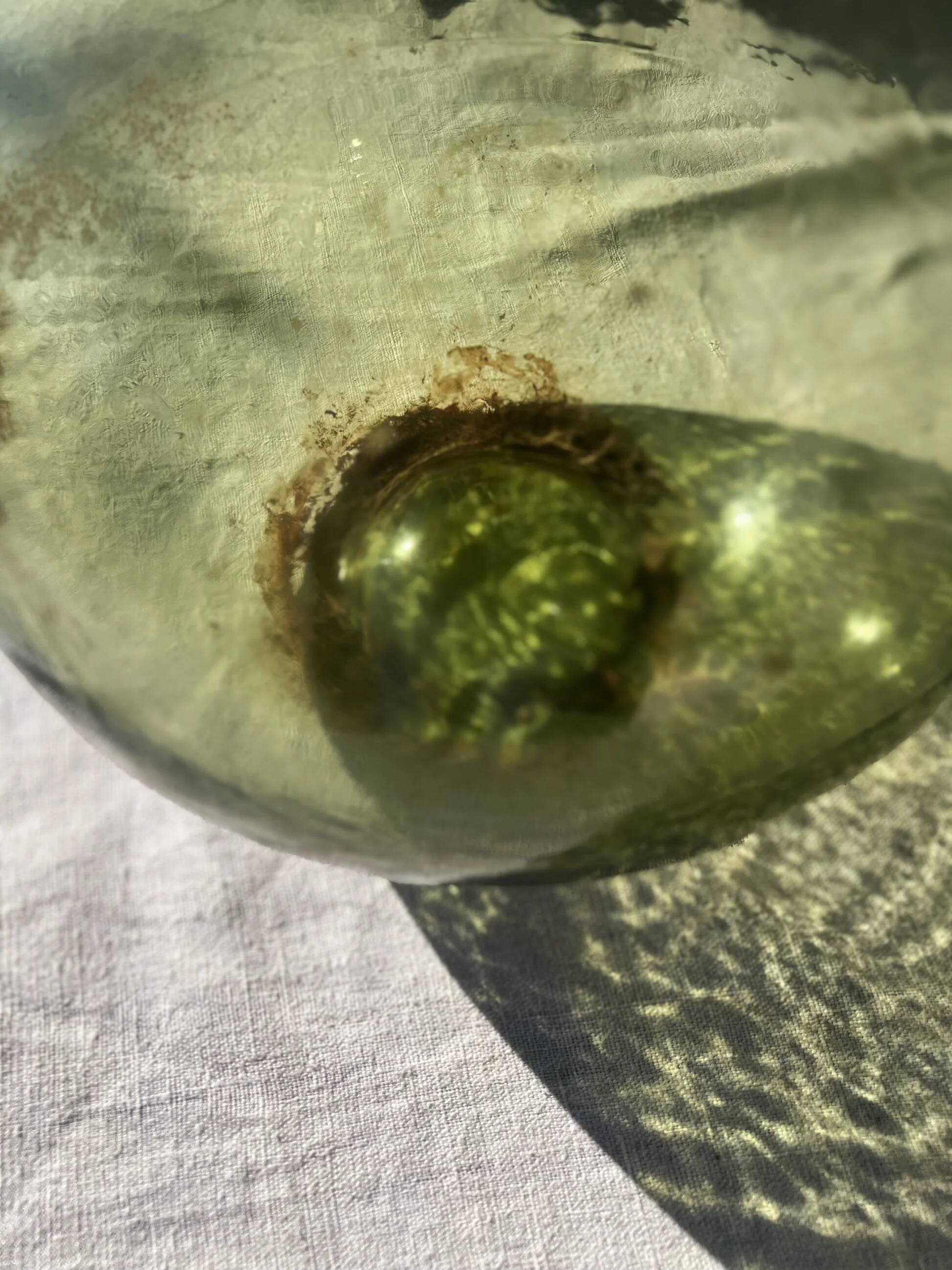 Large French green glass demijohn