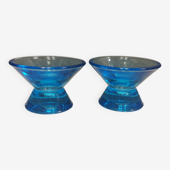 Two small candle holders in blue glass from the well-known Finnish company Ittala.