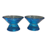 Two small candle holders in blue glass from the well-known Finnish company Ittala.
