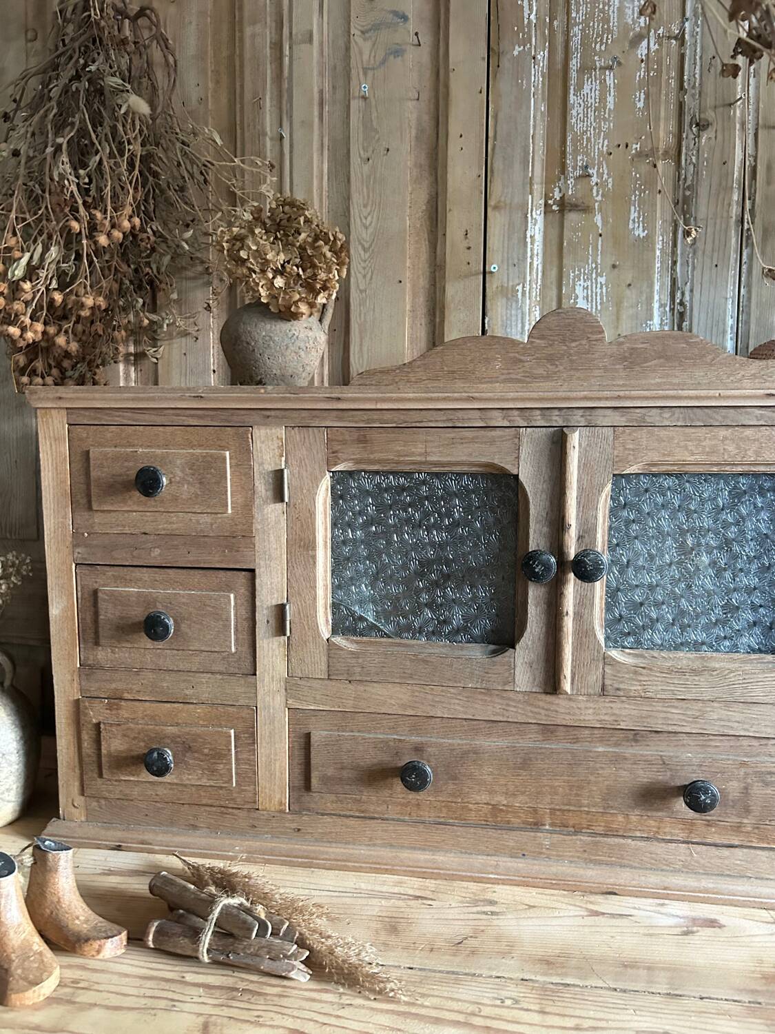 Small piece of furniture with glass doors and drawers